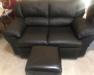 Black leather loveseat with ottoman. Exc. cond.