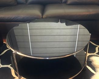 Round 2-level glass/chrome coffee table on wheels