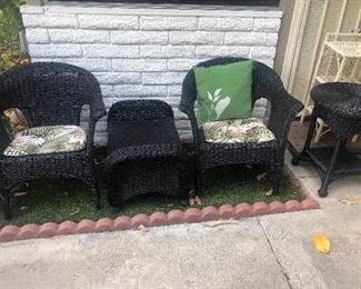 Black wicker patio set; small white wicker accent piece
