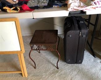 Small tables and suitcase