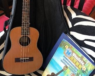 Ukelele with case and music books