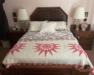 Carved Oak Bed, Quilts, Lamps and antique bedside chests.