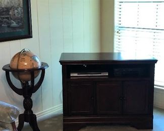 Free standing globe and entertainment cabinet