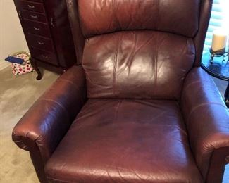 One of three brown leather lazy boys