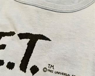 Cool collection of mostly 1982 original E.T. paraphernalia, including a never worn Hershey’s E.T. T-shirt & beanie, magazines cards and posters