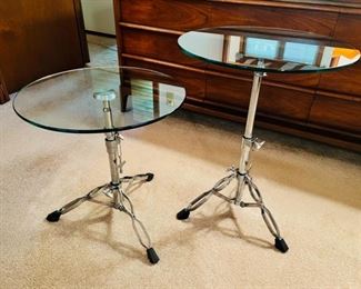 Unique and rare vintage glass top “Snare” tables.  These tables are height adjustable and the spread of the legs is also adjustable
