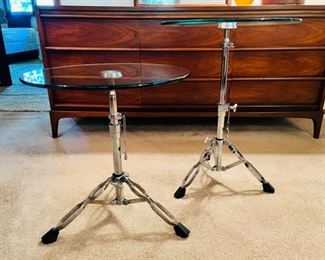 Unique and rare vintage glass top “Snare” tables. These tables are height adjustable and the spread of the legs is also adjustable
