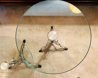 Unique and rare vintage glass top “Snare” tables. These tables are height adjustable and the spread of the legs is also adjustable