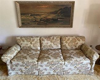 Vintage upholstered couch by Hickory Tavern; framed mid-century print by artist Robert Wood.