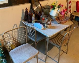 Vintage card table with four chairs.