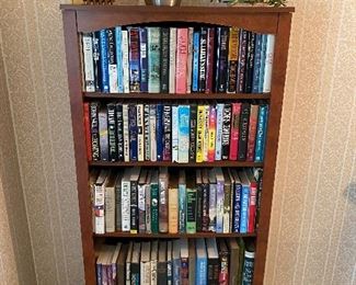 Five-shelf bookcase; books.
