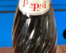 1950s Pepsi 6.5 Oz Swirl Bottle Full	8in H x 2.25in diameter at bottom	
