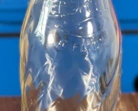 Pepsi 10 oz Swirl Bottle Empty	7.25in H x 2.25in diameter	
