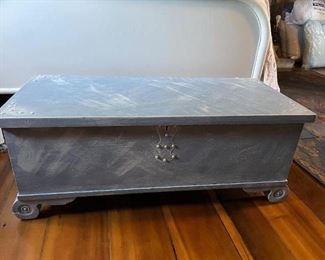 Baby blue painted cedar chest.