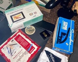 Digital Photo Frame, Calligraphy Set, Professional Stapler, Texans Give Away Towels