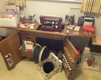 Sewing Cabinet has build in Viking Sewing Machine. Accessories such as threads. Above accessories on top are Sold Separately. Manuals. Vintage Hat in Hat Box. Old Round Vintage Hat Box. Some pictures. Other White House Pink Hat Box, Black Bottom.