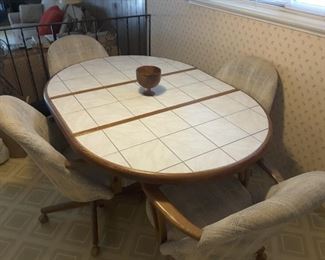 View of Tile Ceramic and Wood Kitchen Table and 4 Fabric Chairs.