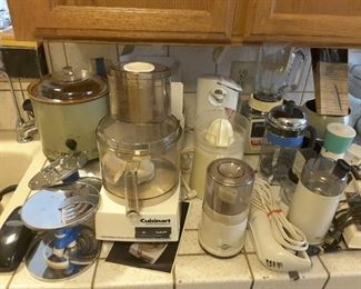 Kitchen Small Appliances: Fondue Pot Electric and Fondue Forks 12 pieces. Weight Watcher's Scale. Osterizer Galaxy Blender. Sunbeam Can Opener Electric. Cuisinart Food Processor DLC-8 and Discs. Discs Holder. 6 quart Crock Pot Rival. Handy Can Opener. Electric Juicer No Lid. West Blend Coffee Grinder. Hamilton Beach Electric Knife. French Press Coffee Maker.