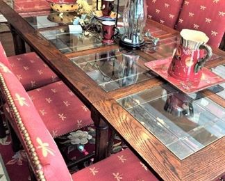 Each chair is beautifully upholstered with nailhead trim.