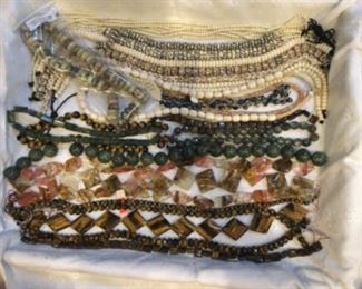 Tiger eye, carved bone, jadite, 