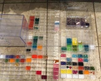 Divided boxes with varying amounts of beads, priced way cheap, based on volume