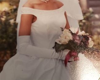 Bridal Gown is stored in an Heirloom Box, size 4