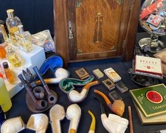 Art Nouveau smoker's cabinet along with some carved Meerschaum pipes.