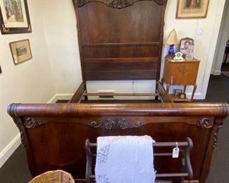 Beautiful and stately carved wood 3/4 bed frame.