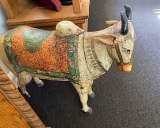 Antique solid wood Sacred Cow.