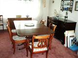 Duncan Phyfe drop leaf mahogany table with 5 leaves & 6 chairs plus buffet. Lovely!