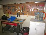 Work bench stays with house.