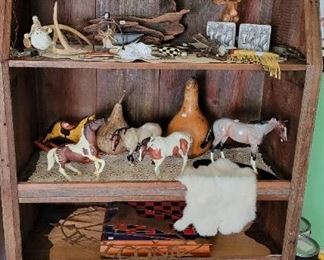 Book case and horse figurines