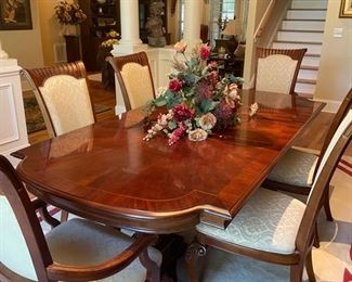 Dining room table and 6 side chairs 2 captains chairs 2 leaves 