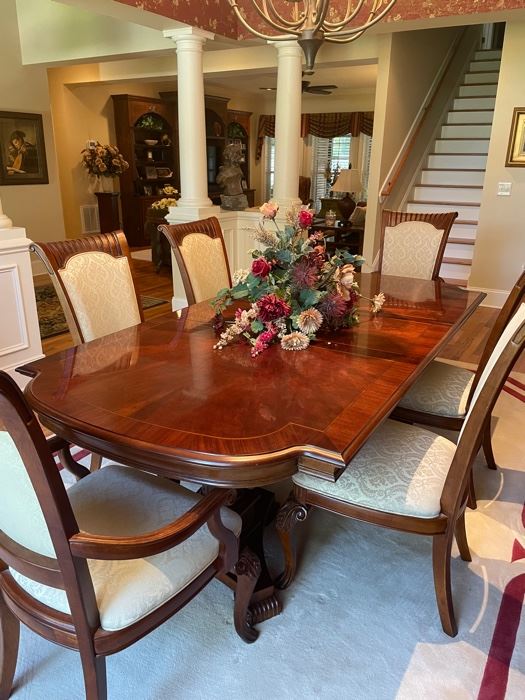 Dining room table and 6 side chairs 2 captains chairs 2 leaves 