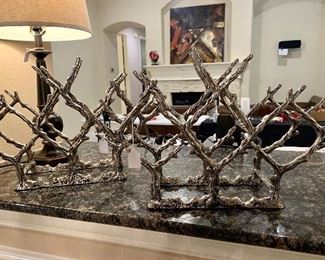 These neat “coral” metal wine racks