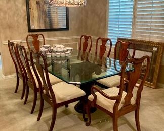 Gorgeous glass dining table with concrete pillars & chairs