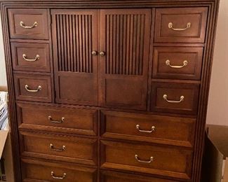#12. $290. Stanley Furniture Gentleman's Chest of drawers. 12 drawers and one cupboard.  56"w x 63.5"h x 20"d.    Matching nightstand in the next photo.  