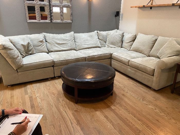 #21 $1200 Fabulous sectional in like new condition. Neutral tone with good durable fabric. "L" along the grey wall to the corner is 150" x 42"d x 32"h. "L" along the cream colored wall to the corner is 102". Sectional is made up of of four separate pieces.