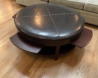 #22 $360 Bernhardt Furniture company leather and wood coffee table with four pullout trays .   Table is  41" diameter x 18"h.  