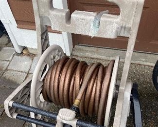 Garden hoses, rakes, brooms and other garden tools for sale during in-person shopping Friday and Saturday