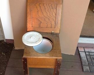oak commode with porcelain bucket