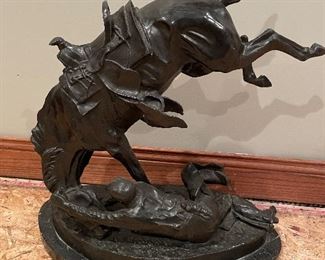 Bronze sculpture by Frederick Remington. 23 1/2” tall. “Wicked Pony”