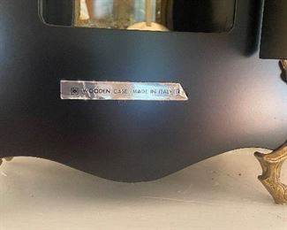 Label on the clock case in the first picture.