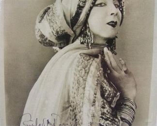 2522   C/1930 Ruth S. Denis (American Dancer, 1879-1968) autographed photo, dancer in character, 8” x 10”. Cond: Good overall cond.