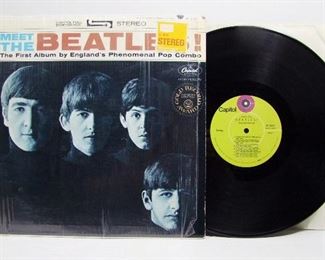 2544*   Capitol ST 2047 (LP), Jan. 20, 1964 “Meet the Beatles”, stereo, has orig. Mylar sleeve with Sears ID sticker. Cond: Record barely played, Cover spine has small dent at top corner, the opening shows light wear.  Overall: 9 Rating.