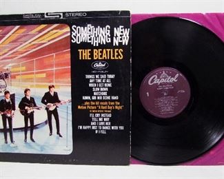 2548   Capitol ST 2108 (LP), July 20, 1964, “Something New”, stereo. Cond: Record shows light play, album spine shows moderate wear with bottom numbers not readable, Front, back & corners show very light wear. Overall: 7 Rating.