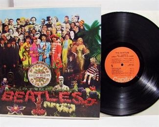 2563   Capitol SMAS 2653 (LP), June 2, 1967 “Sgt. Pepper’s Lonely Hearts Club Band” (RARE MONO RECORDING)  Cond: Record lightly played with Orange Label, Cover spine near perfect, Cover shine at 98%, slight wear to the upper back area, Orig. Cut-out insert is present and has a very light crease near bottom edge. Note: Album is not marked as Stereo, and has the “Maclen Music Inc.”. statement on lower back corner. Overall: 8.5 Rating.