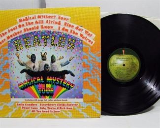 2566   Capitol SMAL 2835 (LP), Nov. 27, 1967 “Magical Mystery Tour” Stereo.   Cond: Record shows light play, Cover spine near mint with light wear & bumps to all 4 corners, cover shine at 95% with less on back, Interior booklet present in the gate fold but de-attached.  Overall: 7.5 Rating.