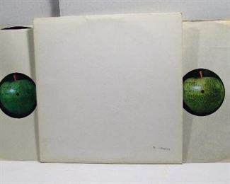 2568   Apple SWBO 101 (2 LPs), Nov. 25, 1968 “The Beatles” (AKA The White Album), Stereo. Includes the Orig. Poster with lyrics (minor folds & light creases).  Cond: Record shows light wear from play, Cover spine is clean with sm. dents at both ends/corners, Cover shine approx. 90% with back at 85%, Serial # stamped: 2380819  Overall: 8 Rating.