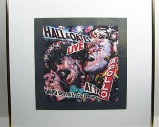 2576   1985 Poster for “Hall & Oats Live at the Apollo with David Ruffin” 15” X 15” in a metal frame 24” X 24”. Cond: Poster has a few light creases.